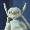Unpainted posable figure of Kasumi in her Alien Party outfit wearing boxing gloves.